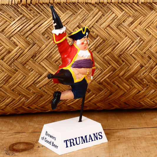 Advertising, Breweriana - a Trumans 'rubberoid' type point of sale advertising figure, depicting a jumping pirate or sailor with a peg leg holding a bottle, 18.6cm high