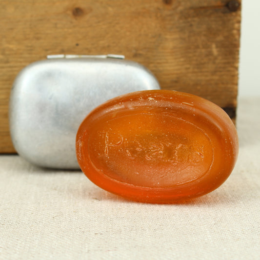 A World War II British Army aluminium soap tin, impressed marks 'W.S.L., 1945, (Broad Arrow), CC 1114'