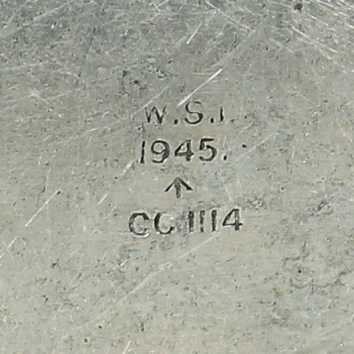 A World War II British Army aluminium soap tin, impressed marks 'W.S.L., 1945, (Broad Arrow), CC 1114'