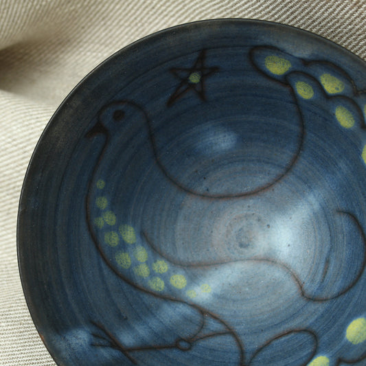 Tessa Fuch (British 1936-2012), matte glazed bowl, decorated with a stylized Bird and star, 16cm diameter, impressed initials to base