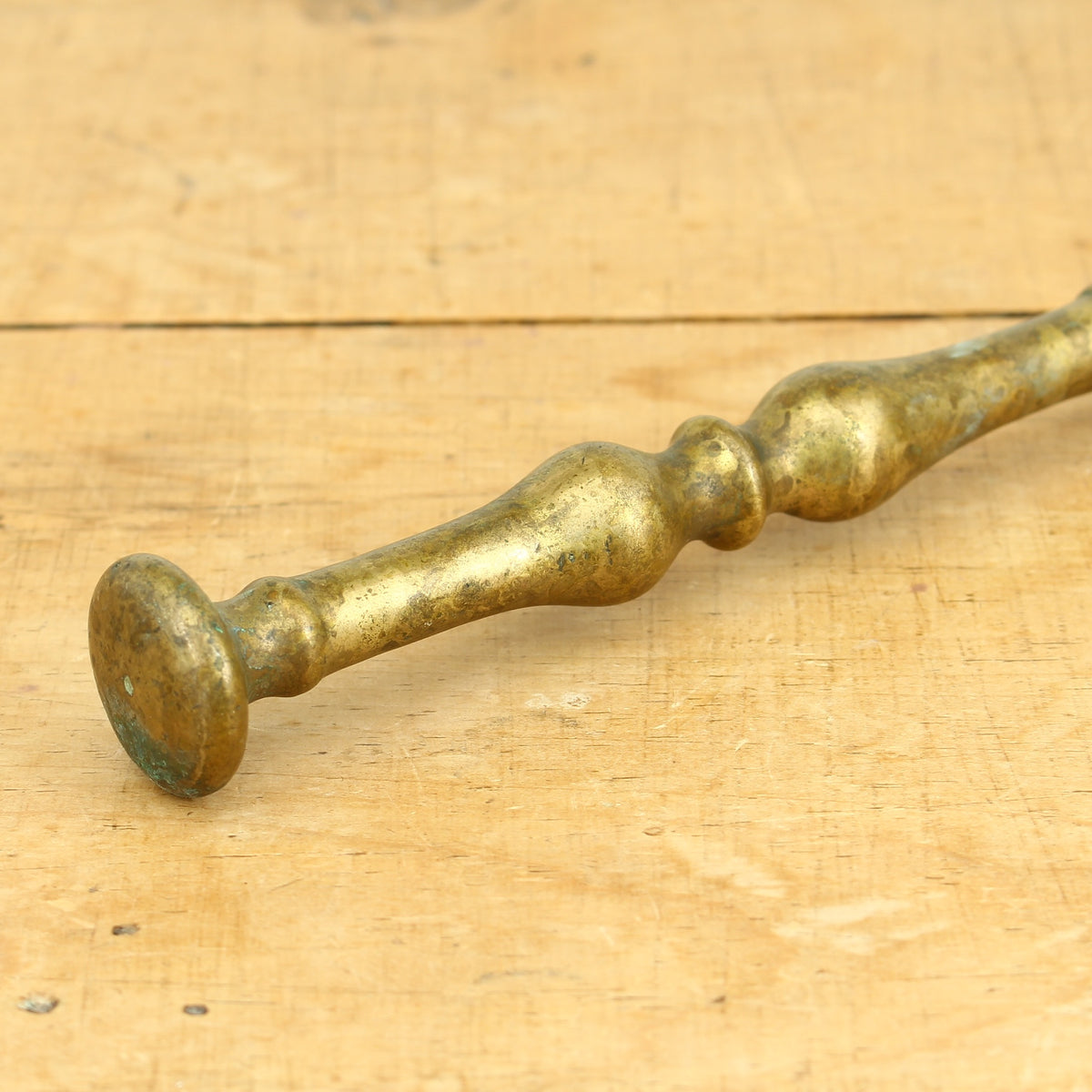 A 19th century bronze mortar and pestle, cylindrical form with girdle and everted rim