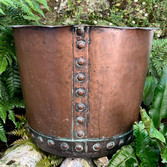 A late 19th century/early 20th century riveted copper boiler or country house fuel bin