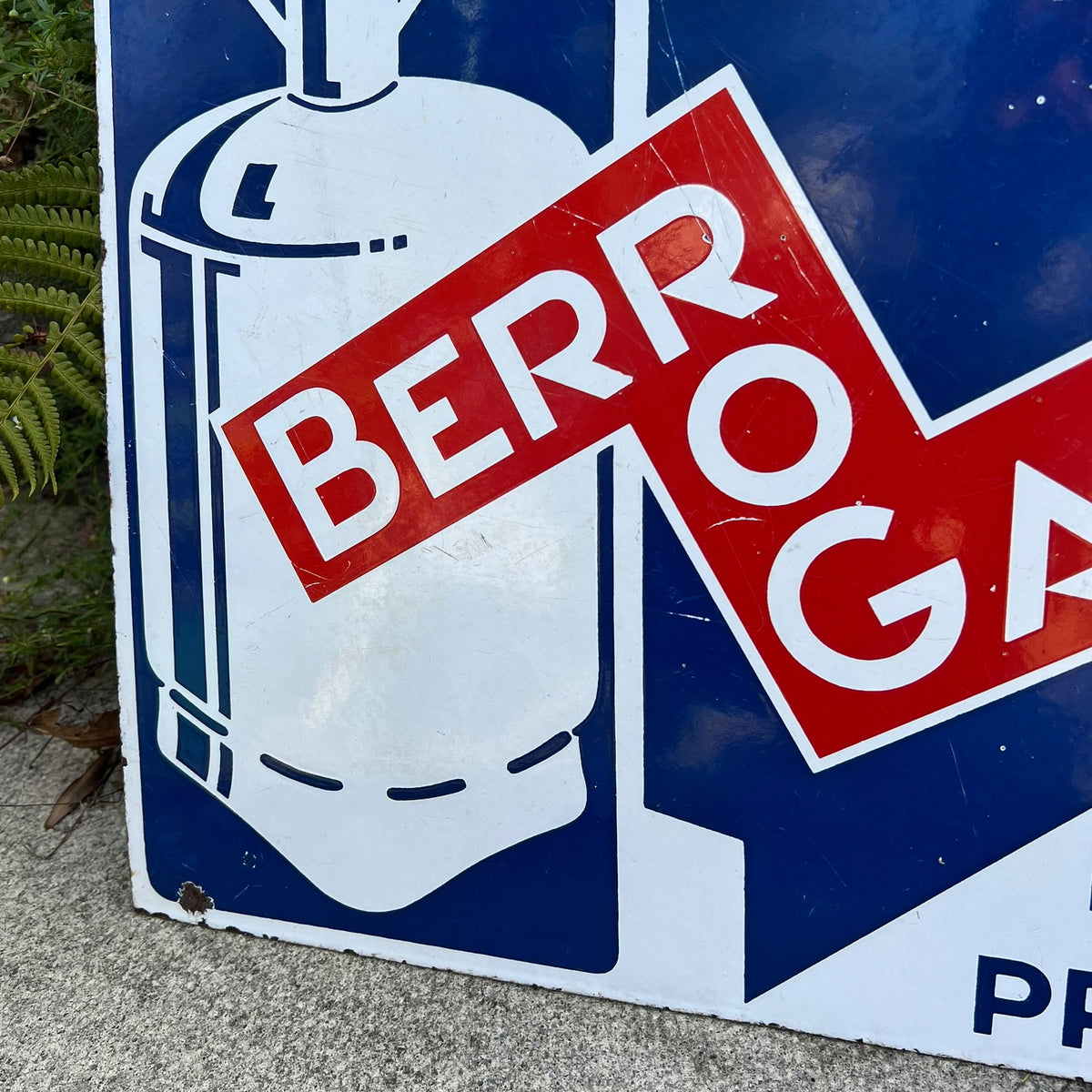 Advertising - a French double sided pictorial flanged enamel advertising sign, Berrogaz