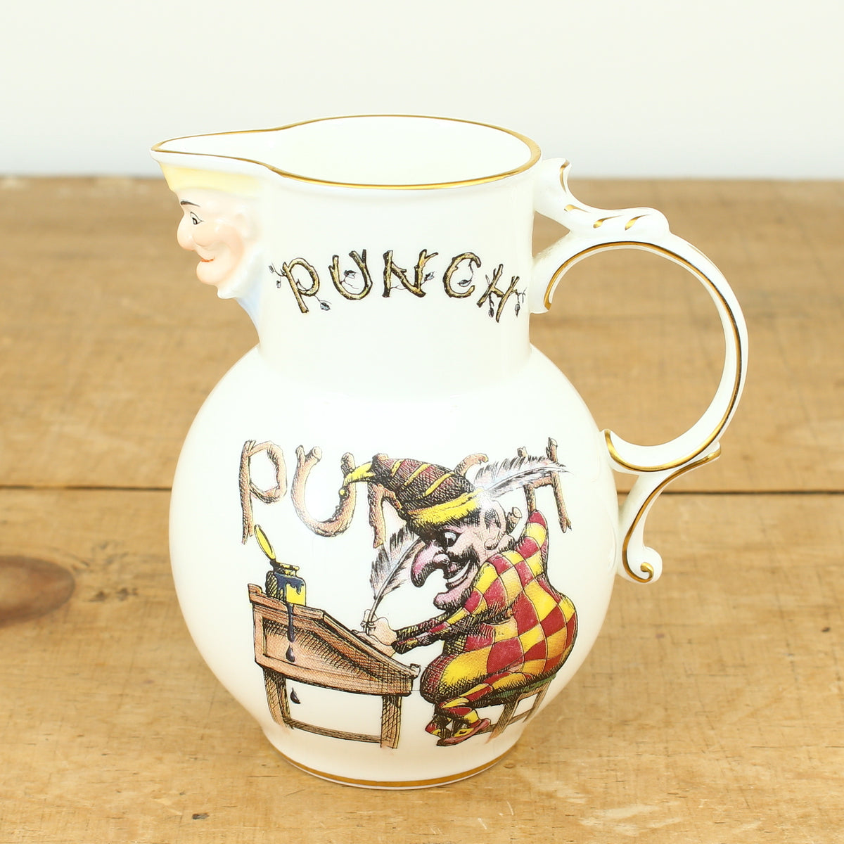 A Coalport Punch Publications porcelain jug, transfer printed decoration with an illustration of Mr.Punch