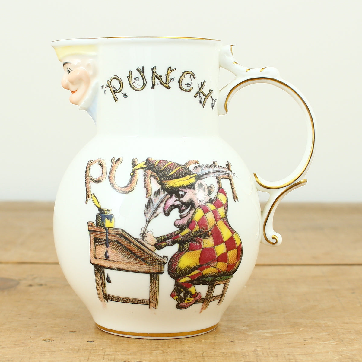 A Coalport Punch Publications porcelain jug, transfer printed decoration with an illustration of Mr.Punch