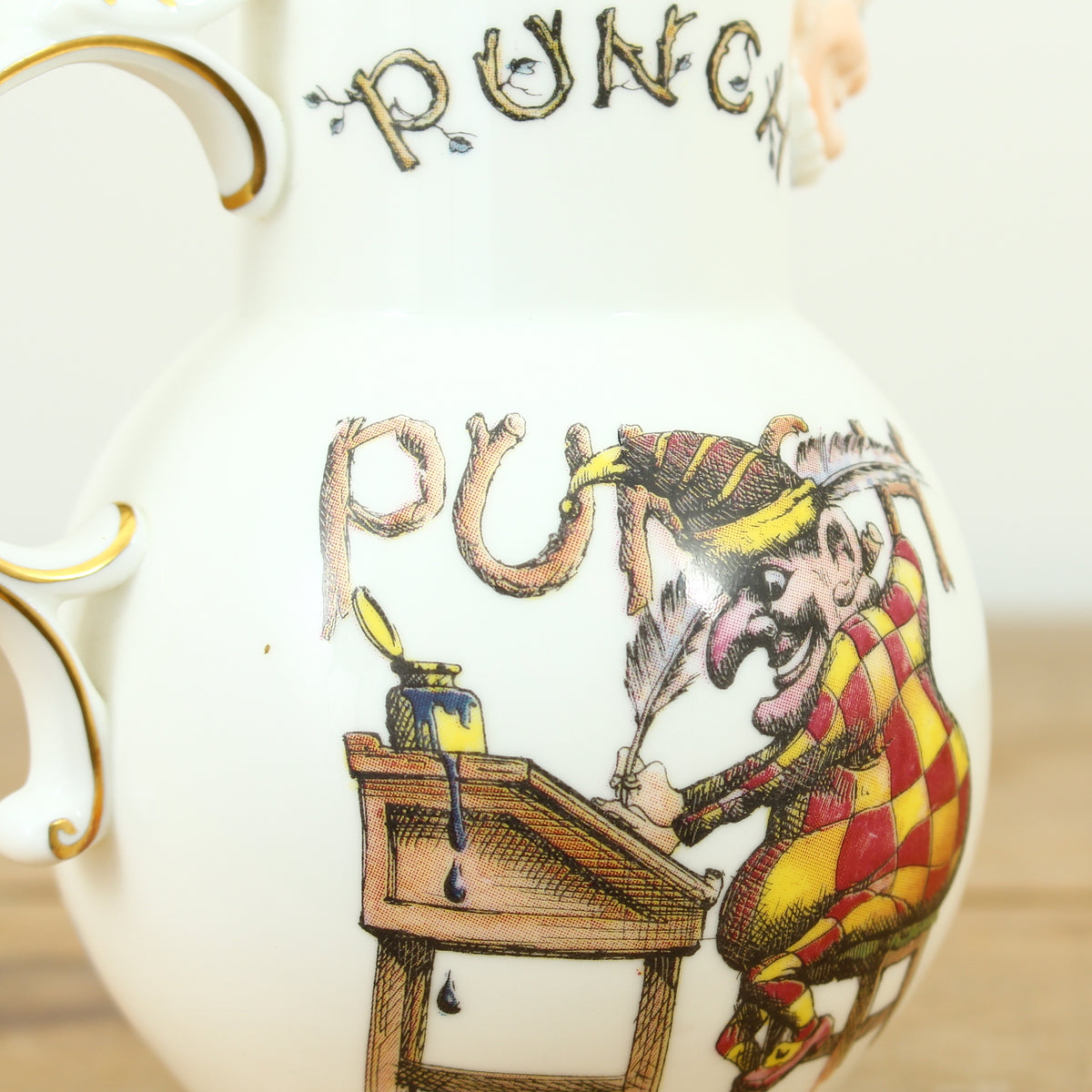 A Coalport Punch Publications porcelain jug, transfer printed decoration with an illustration of Mr.Punch