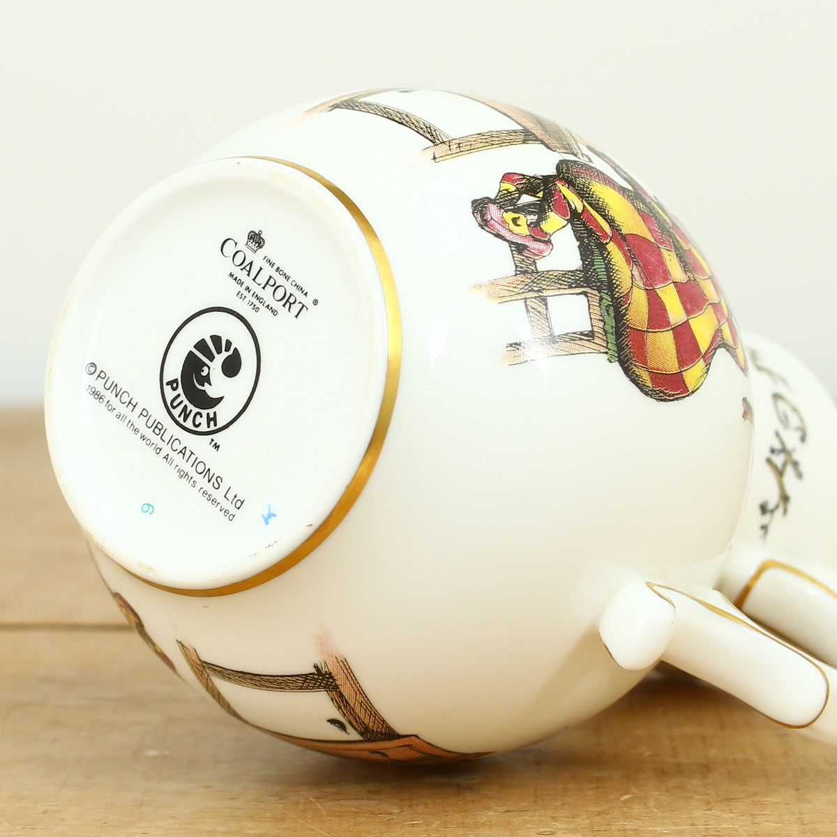 A Coalport Punch Publications porcelain jug, transfer printed decoration with an illustration of Mr.Punch