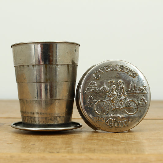 Cycling Interest - a silver coloured metal collapsible travel cup, embossed lid, 'Cyclist's Cup'