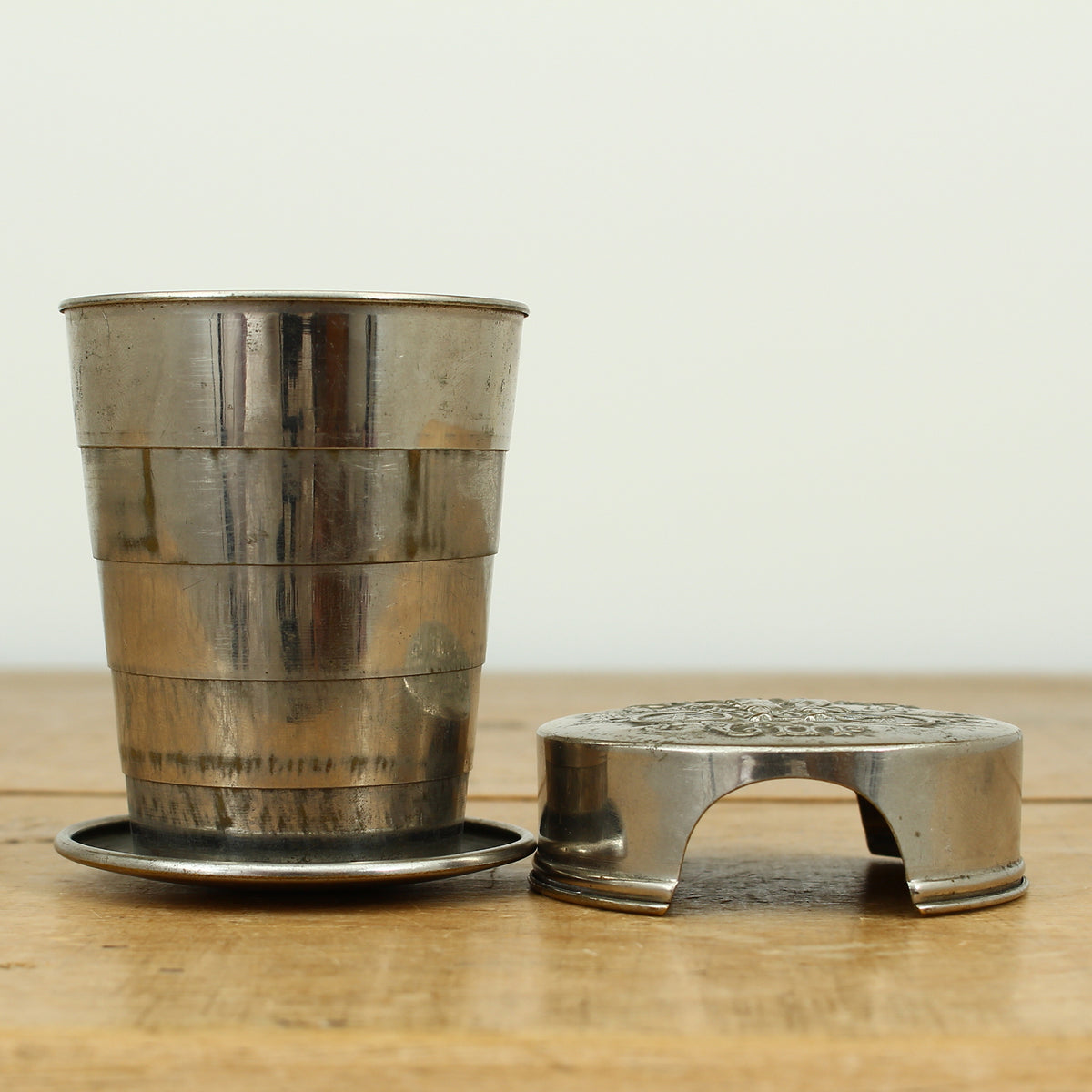 Cycling Interest - a silver coloured metal collapsible travel cup, embossed lid, 'Cyclist's Cup'