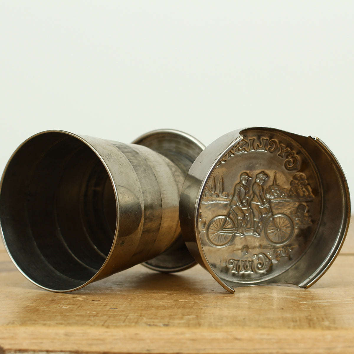 Cycling Interest - a silver coloured metal collapsible travel cup, embossed lid, 'Cyclist's Cup'