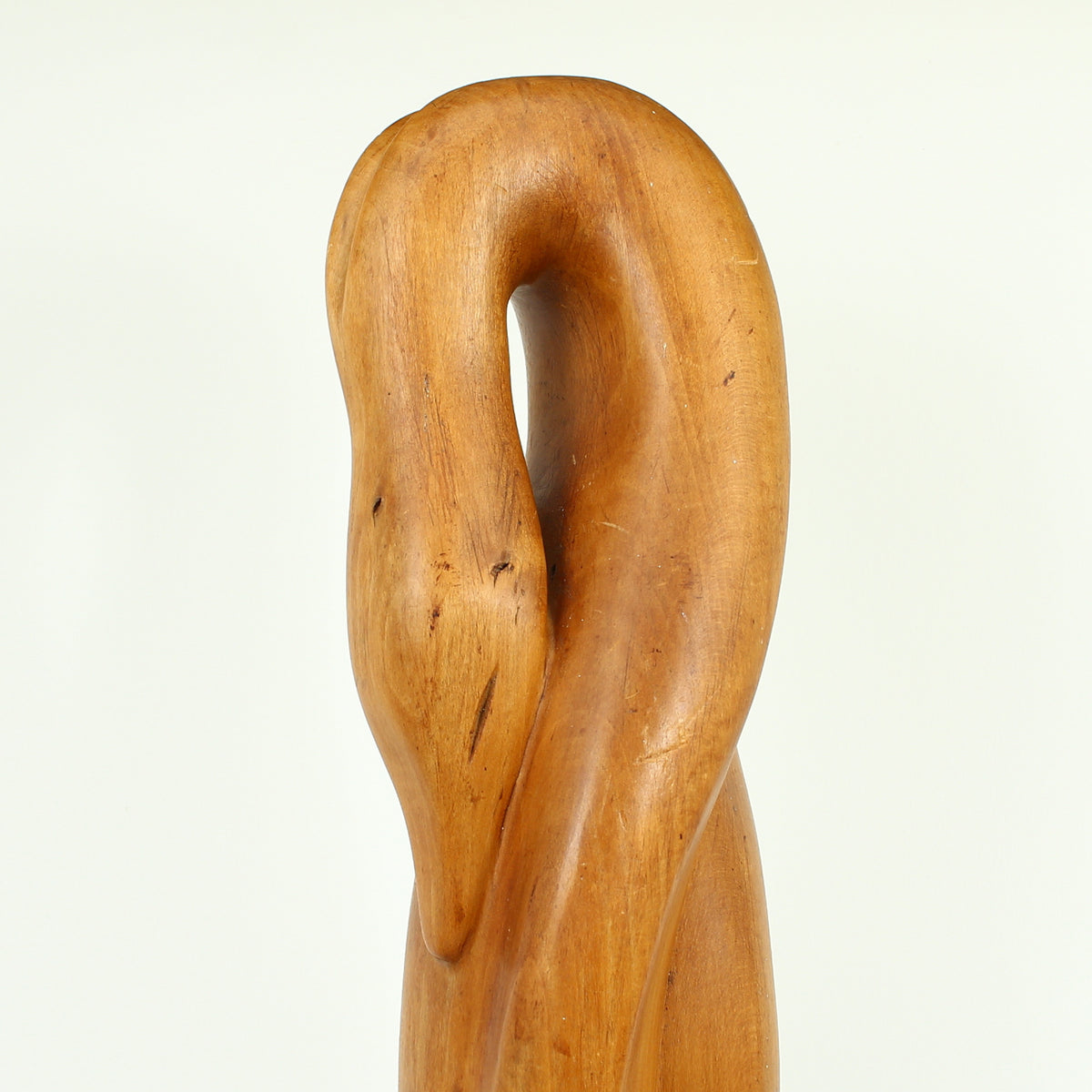 Jean W Cubrie (French)  - a wooden sculpture, Cygne Mysterieux (Mysterious Swan), inscribed to base, 42cm high overall