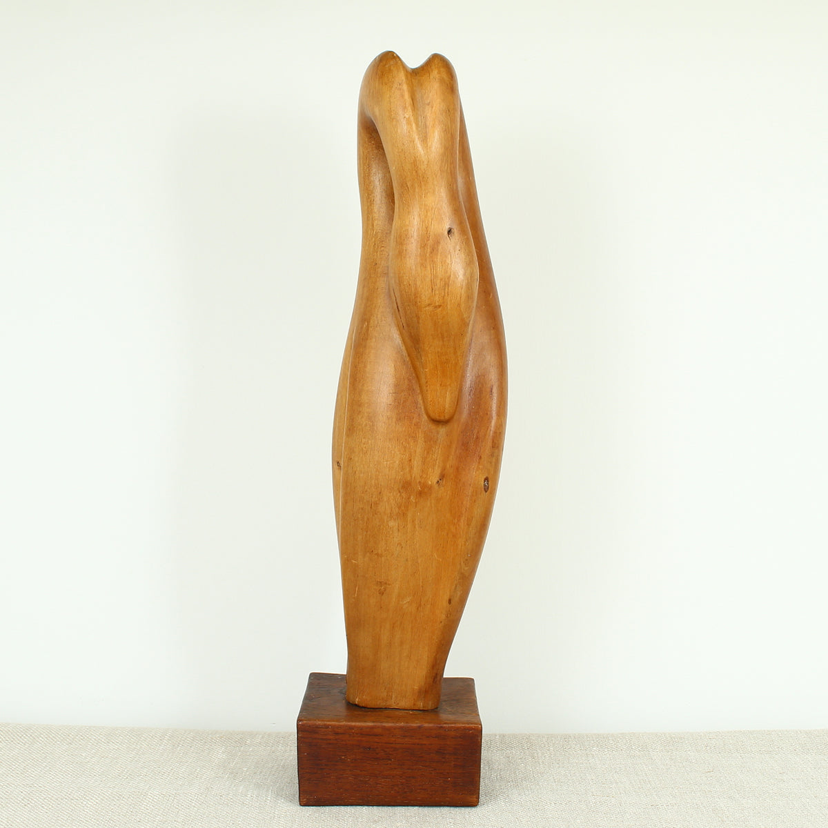 Jean W Cubrie (French)  - a wooden sculpture, Cygne Mysterieux (Mysterious Swan), inscribed to base, 42cm high overall