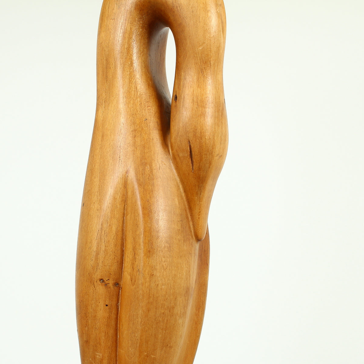 Jean W Cubrie (French)  - a wooden sculpture, Cygne Mysterieux (Mysterious Swan), inscribed to base, 42cm high overall