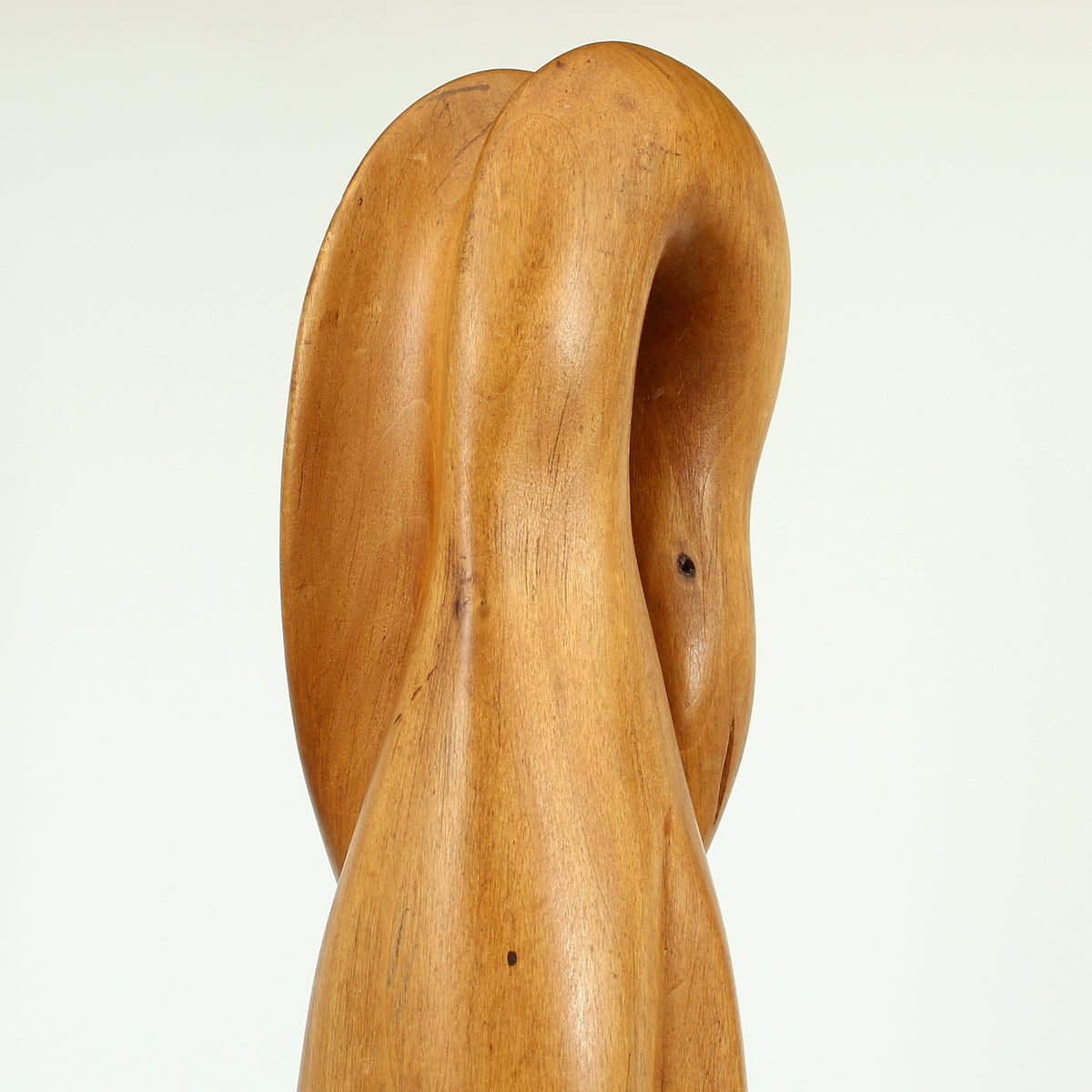 Jean W Cubrie (French)  - a wooden sculpture, Cygne Mysterieux (Mysterious Swan), inscribed to base, 42cm high overall