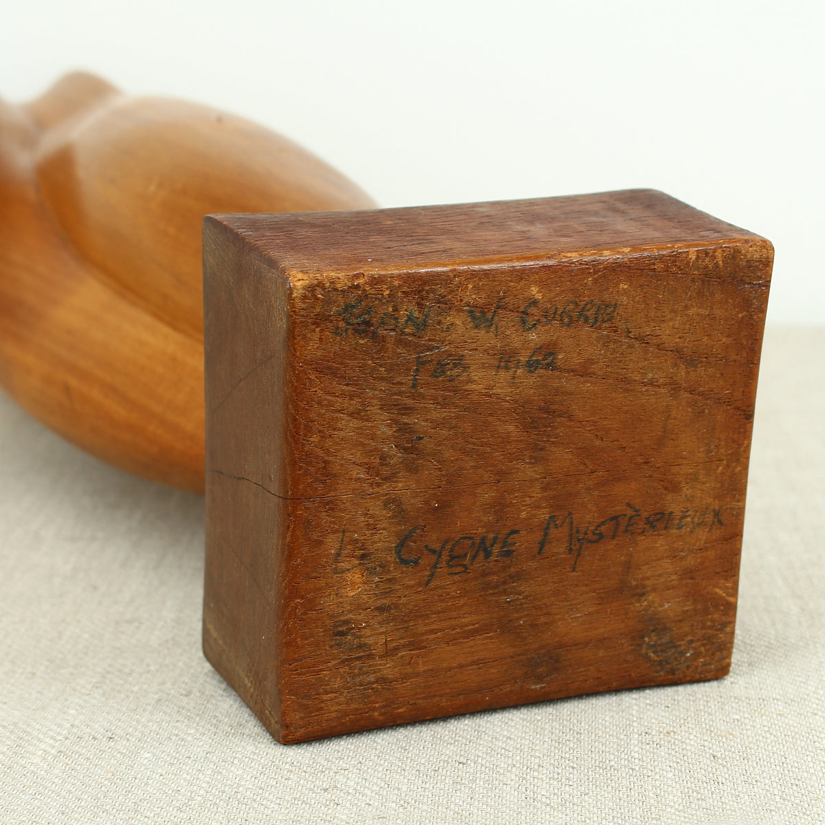 Jean W Cubrie (French)  - a wooden sculpture, Cygne Mysterieux (Mysterious Swan), inscribed to base, 42cm high overall