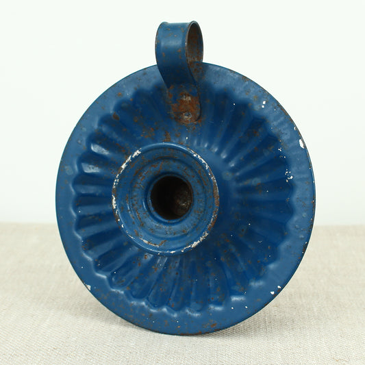 A vintage blue metal chamberstick/candle holder, simple loop handle, 16cm diameter