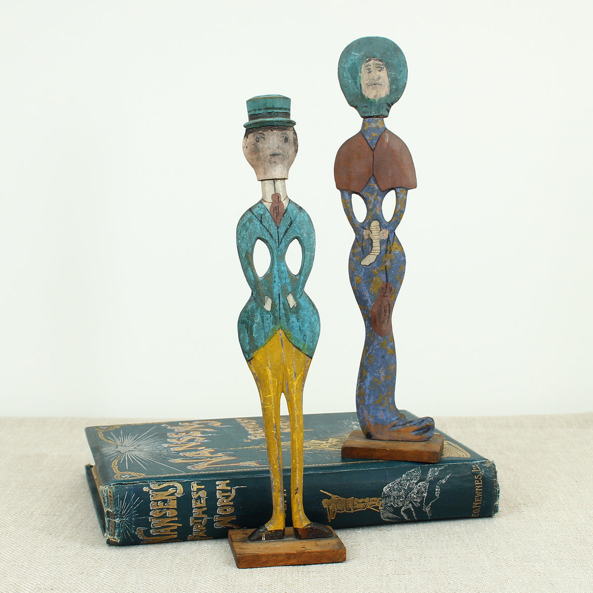 Treen, Folk Art - a pair of early 20th century painted wooden figures, of a well dressed gentleman and lady