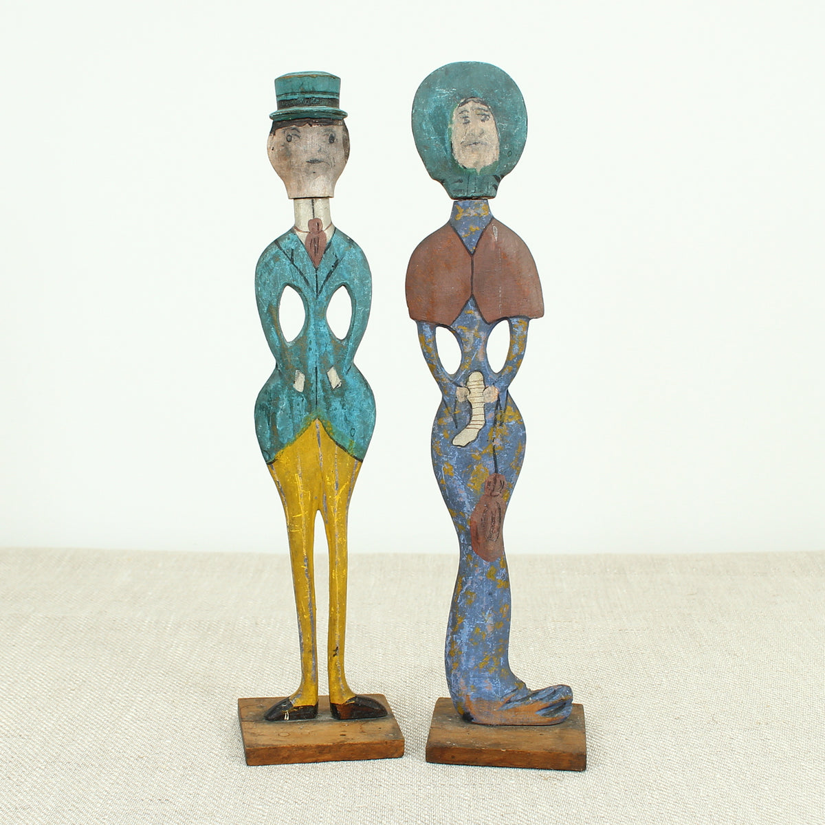 Treen, Folk Art - a pair of early 20th century painted wooden figures, of a well dressed gentleman and lady
