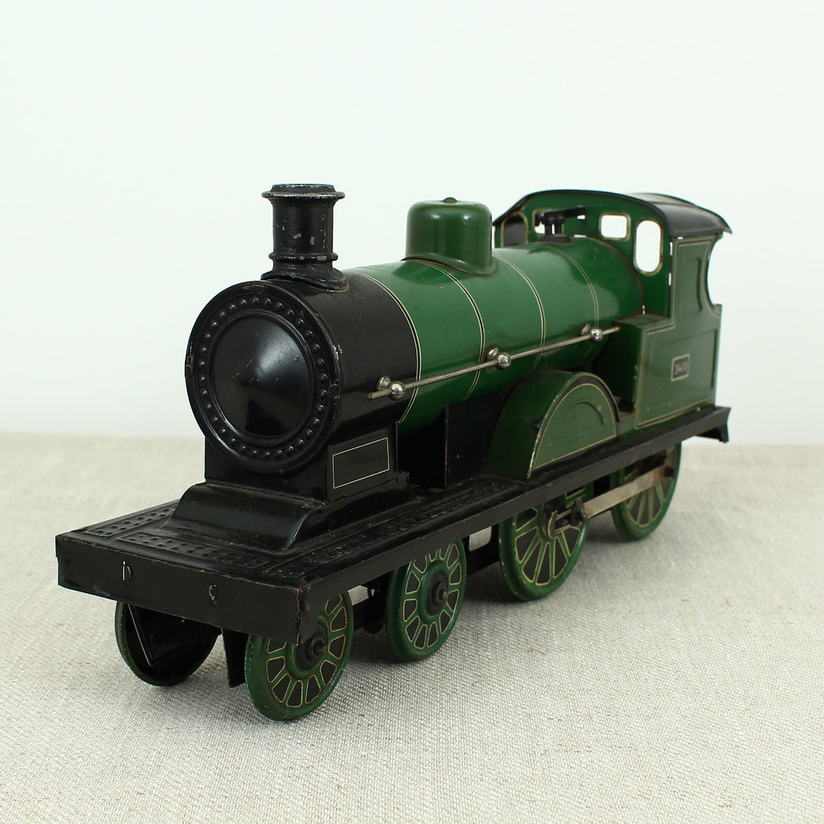 Toys & Juvenalia - a Gebrüder Bing (Germany) tinplate and clockwork 4-4-0 tank locomotive floor train, green livery, No.3410
