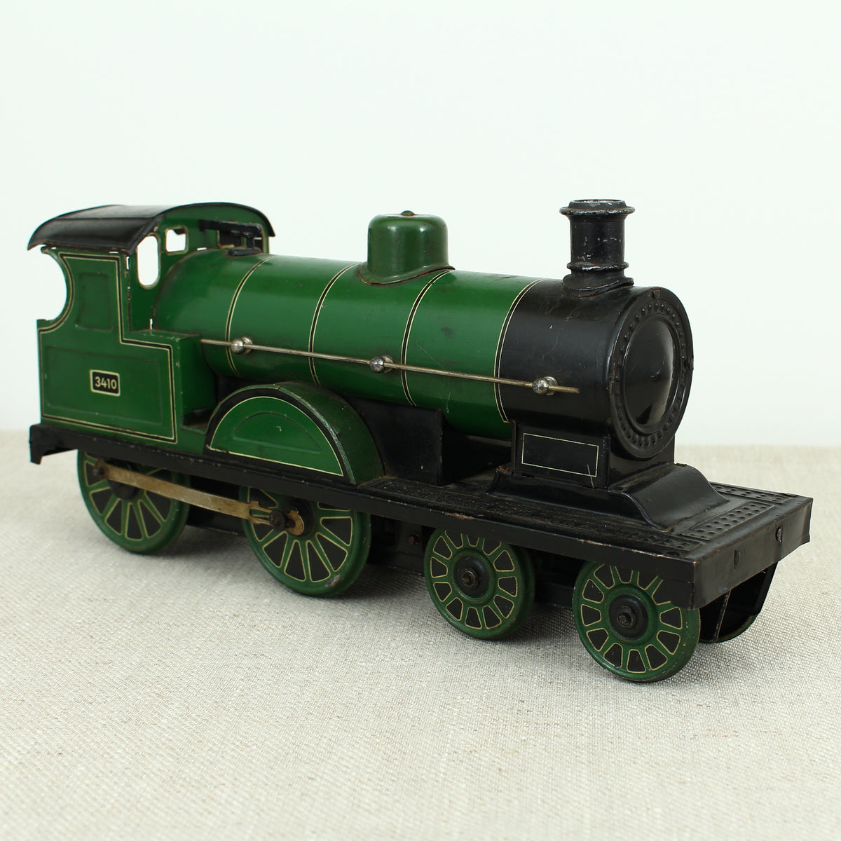 Toys & Juvenalia - a Gebrüder Bing (Germany) tinplate and clockwork 4-4-0 tank locomotive floor train, green livery, No.3410