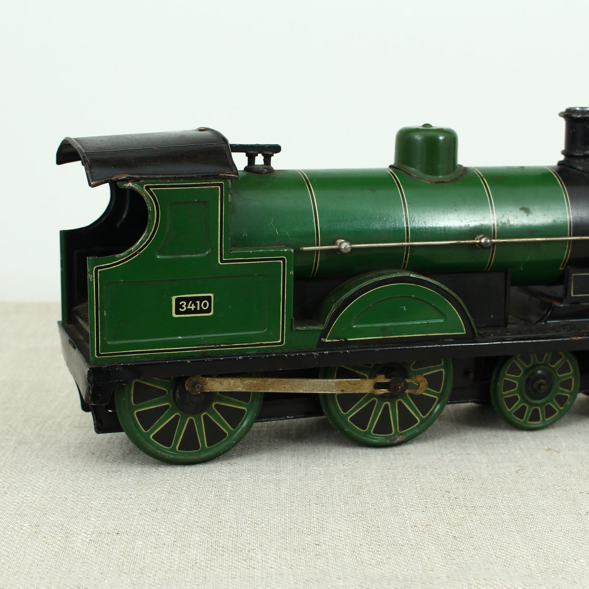 Toys & Juvenalia - a Gebrüder Bing (Germany) tinplate and clockwork 4-4-0 tank locomotive floor train, green livery, No.3410