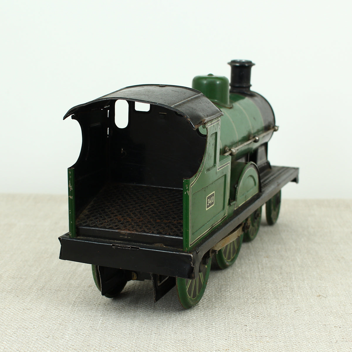 Toys & Juvenalia - a Gebrüder Bing (Germany) tinplate and clockwork 4-4-0 tank locomotive floor train, green livery, No.3410
