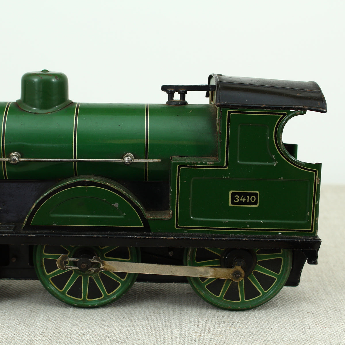 Toys & Juvenalia - a Gebrüder Bing (Germany) tinplate and clockwork 4-4-0 tank locomotive floor train, green livery, No.3410