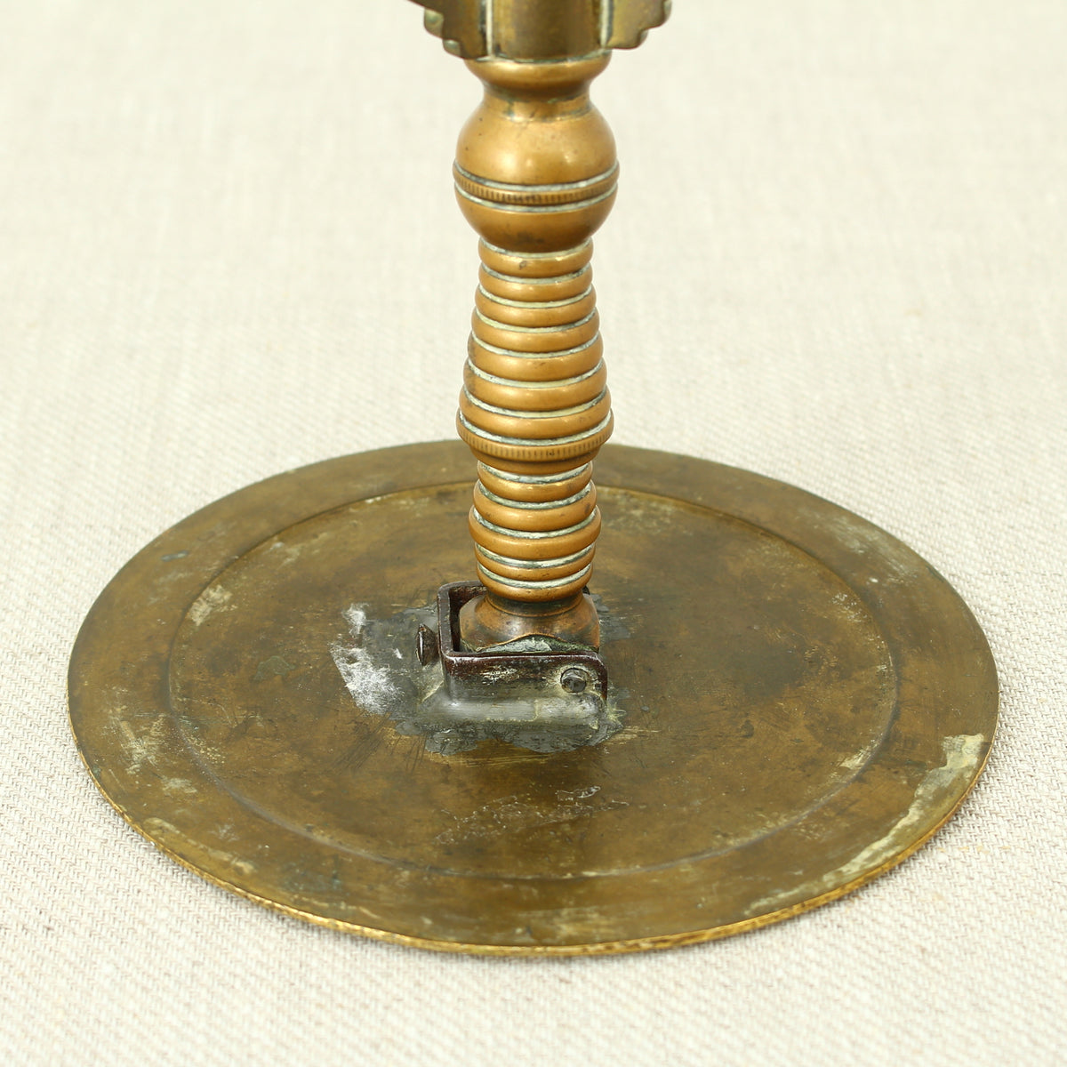 A 19th century Victorian miniature brass tilt top tripod table candle reflector