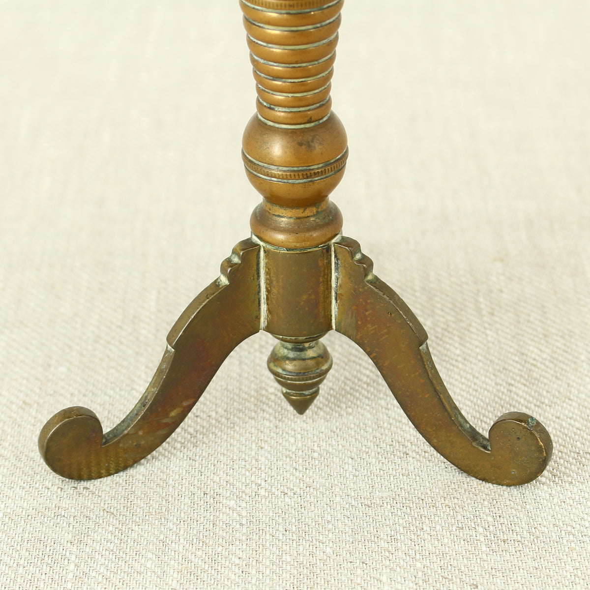 A 19th century Victorian miniature brass tilt top tripod table candle reflector