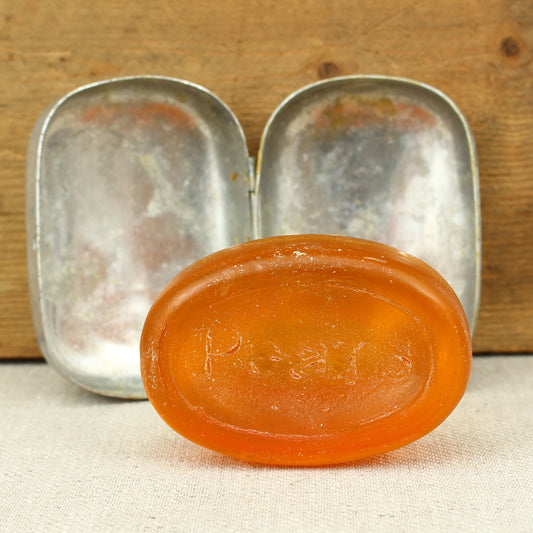 A World War II British Army aluminium soap tin, impressed marks 'W.S.L., 1945, (Broad Arrow), CC 1114'