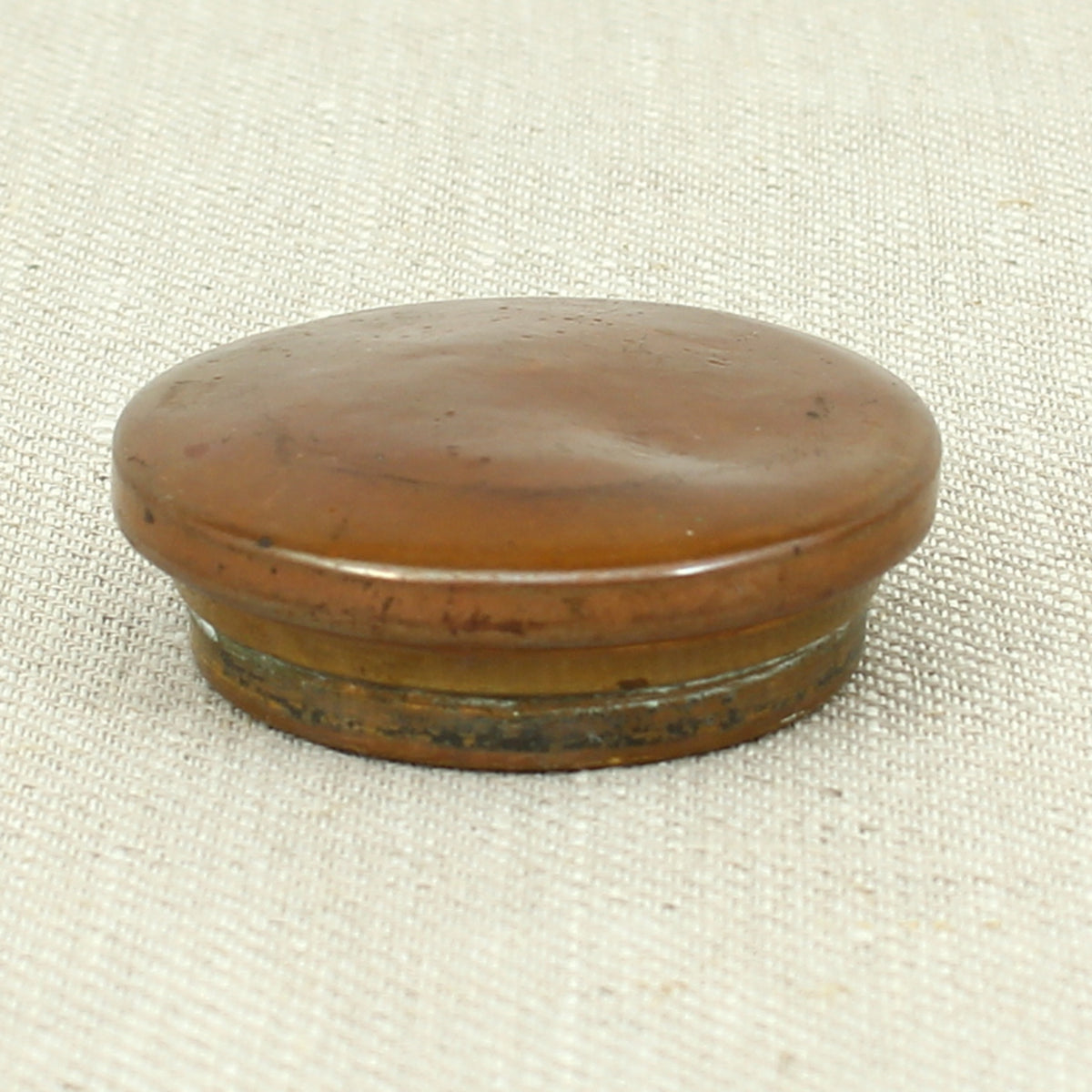 A vintage brass and copper novelty money box or money bank, in the form of a British pillar box
