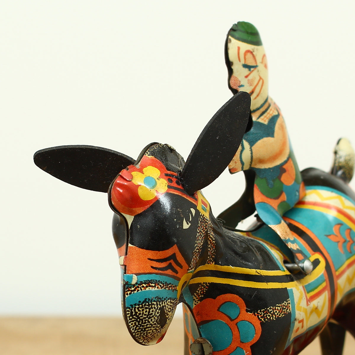 Toys & Juvenalia - a novelty tinplate and fixed clockwork mechanical toy, of a clown riding a Donkey