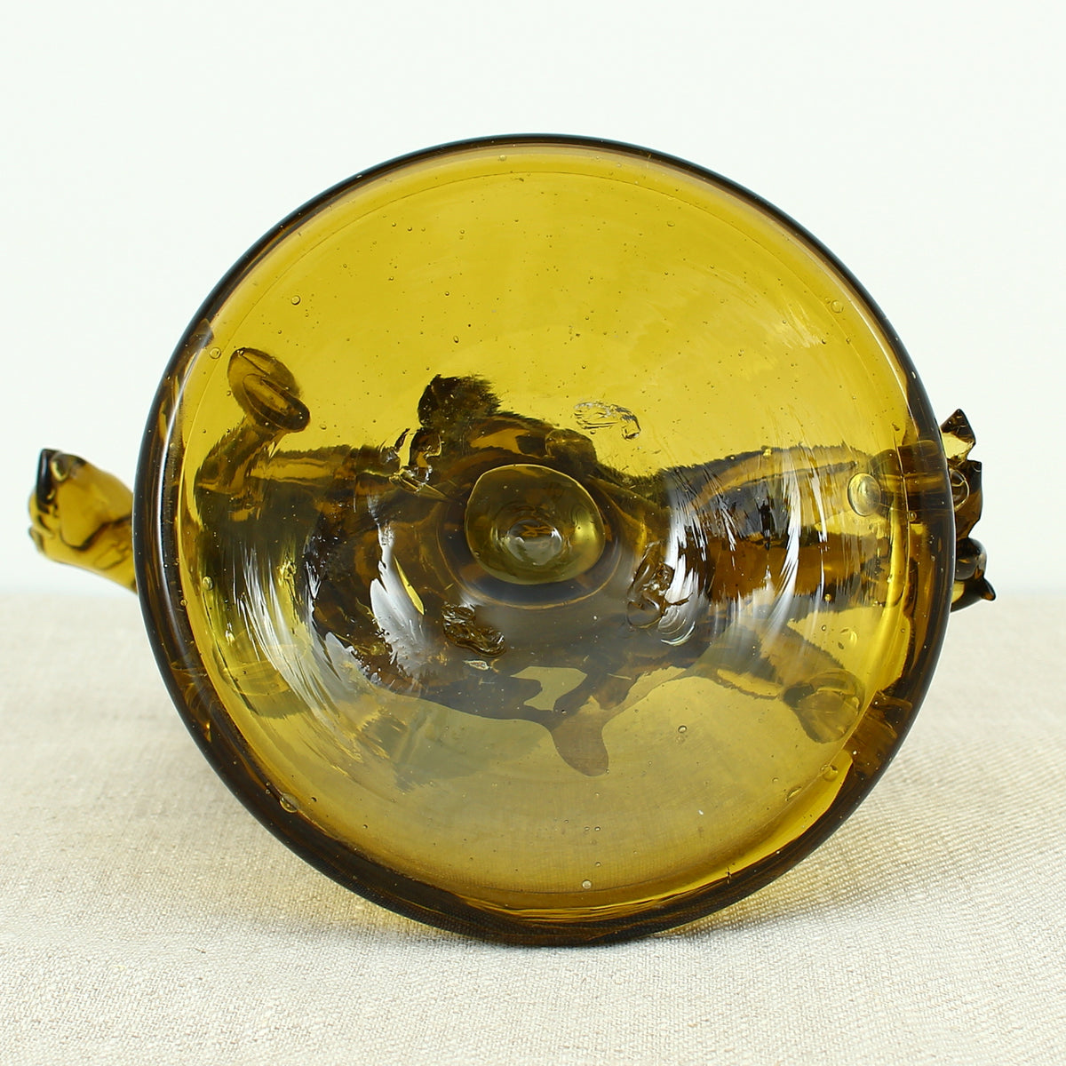 Art Glass & Mid 20th Century Design - an amber glass novelty sculpture, in the form of a Native American Indian riding a Horse with headdress, 20cm high, circular base with pontil marks to underside of base