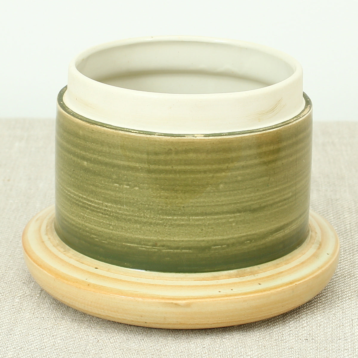 Advertising & Haberdashery Interest - a novelty ceramic jar, in the form of a faux oversized cotton reel, press close cover with printed design, 'DEWHURST'S SYLKO THREE SHELLS, MACHINE TWIST 40', finished in green, 15.5cm high