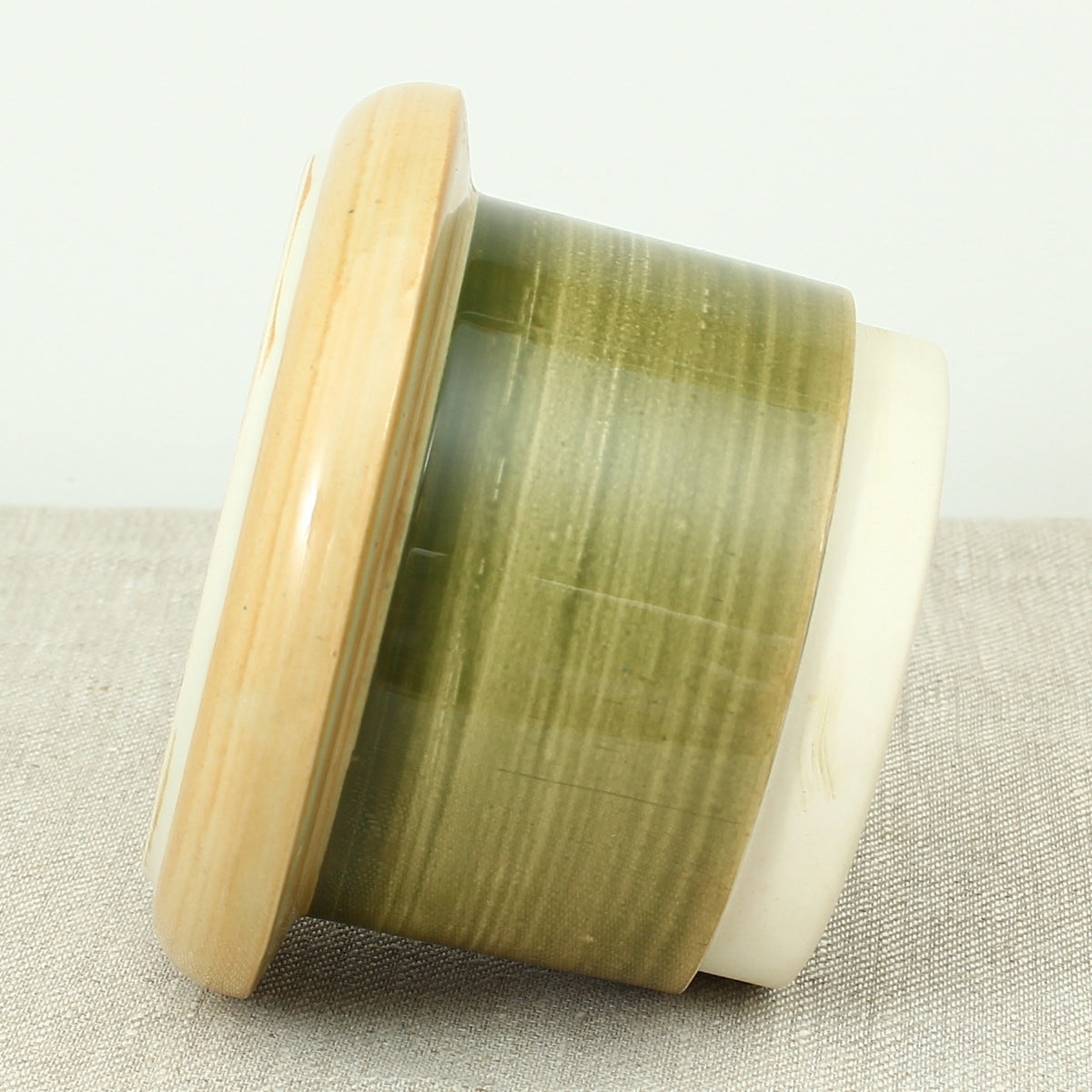 Advertising & Haberdashery Interest - a novelty ceramic jar, in the form of a faux oversized cotton reel, press close cover with printed design, 'DEWHURST'S SYLKO THREE SHELLS, MACHINE TWIST 40', finished in green, 15.5cm high
