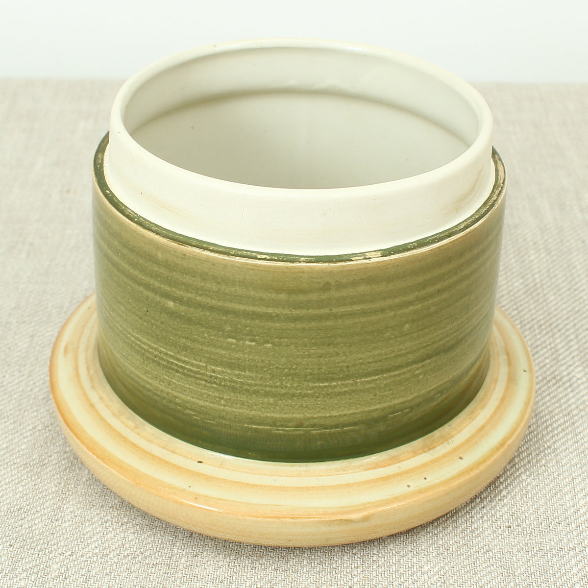Advertising & Haberdashery Interest - a novelty ceramic jar, in the form of a faux oversized cotton reel, press close cover with printed design, 'DEWHURST'S SYLKO THREE SHELLS, MACHINE TWIST 40', finished in green, 15.5cm high