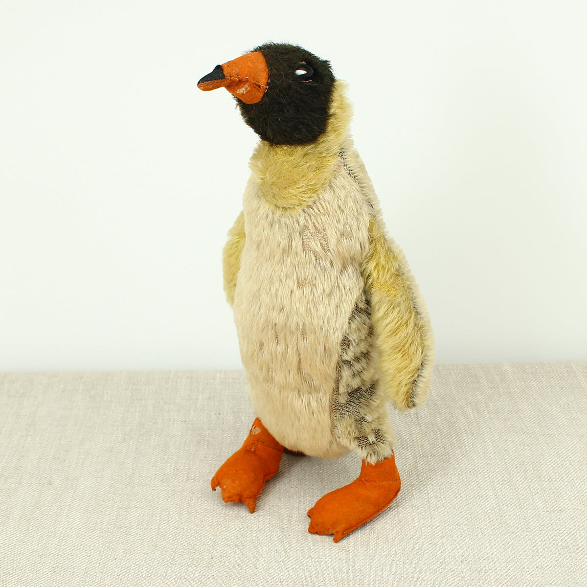 Toys & Juvenalia - a mid 20th century novelty mohair Penguin, black and white plastic eyes, orange and black felt beak, orange felt feet, 32cm high