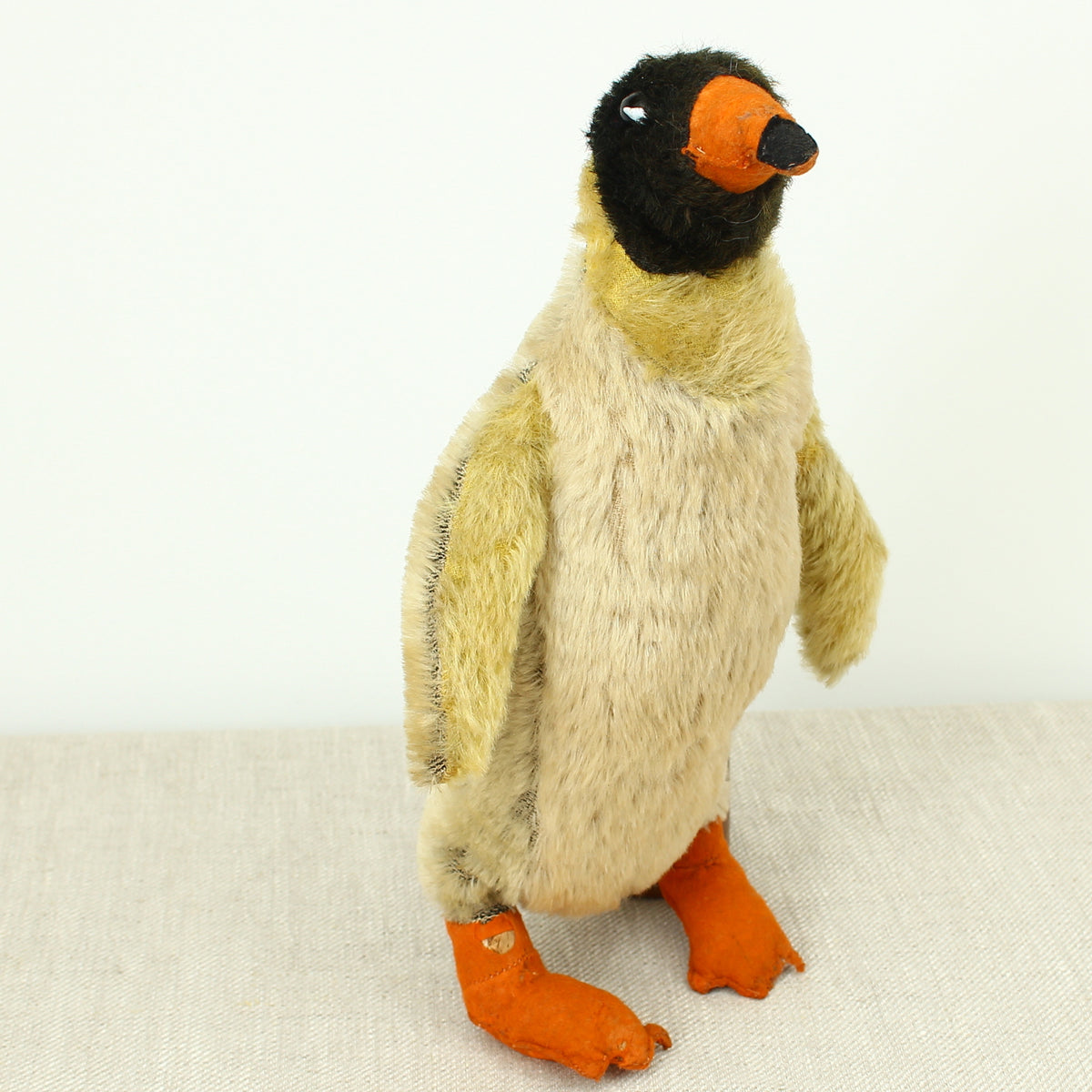 Toys & Juvenalia - a mid 20th century novelty mohair Penguin, black and white plastic eyes, orange and black felt beak, orange felt feet, 32cm high