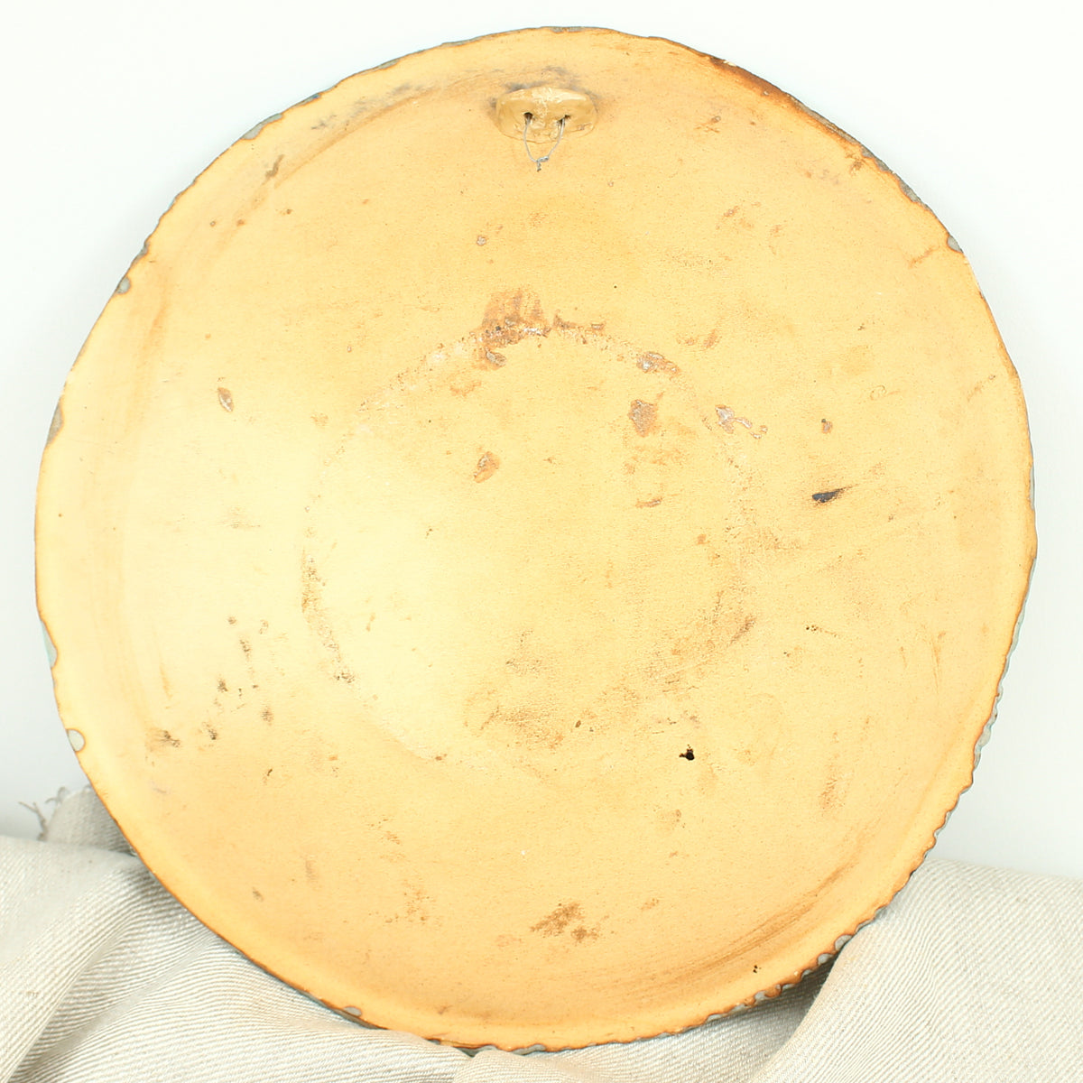 Jacqueline de la Fuente (Sculptural paper clay artist), charger with a study of a nude, serrated edge, signed and dated 2009 to the lower left edge, 34cm diameter