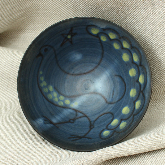 Tessa Fuch (British 1936-2012), matte glazed bowl, decorated with a stylized Bird and star, 16cm diameter, impressed initials to base