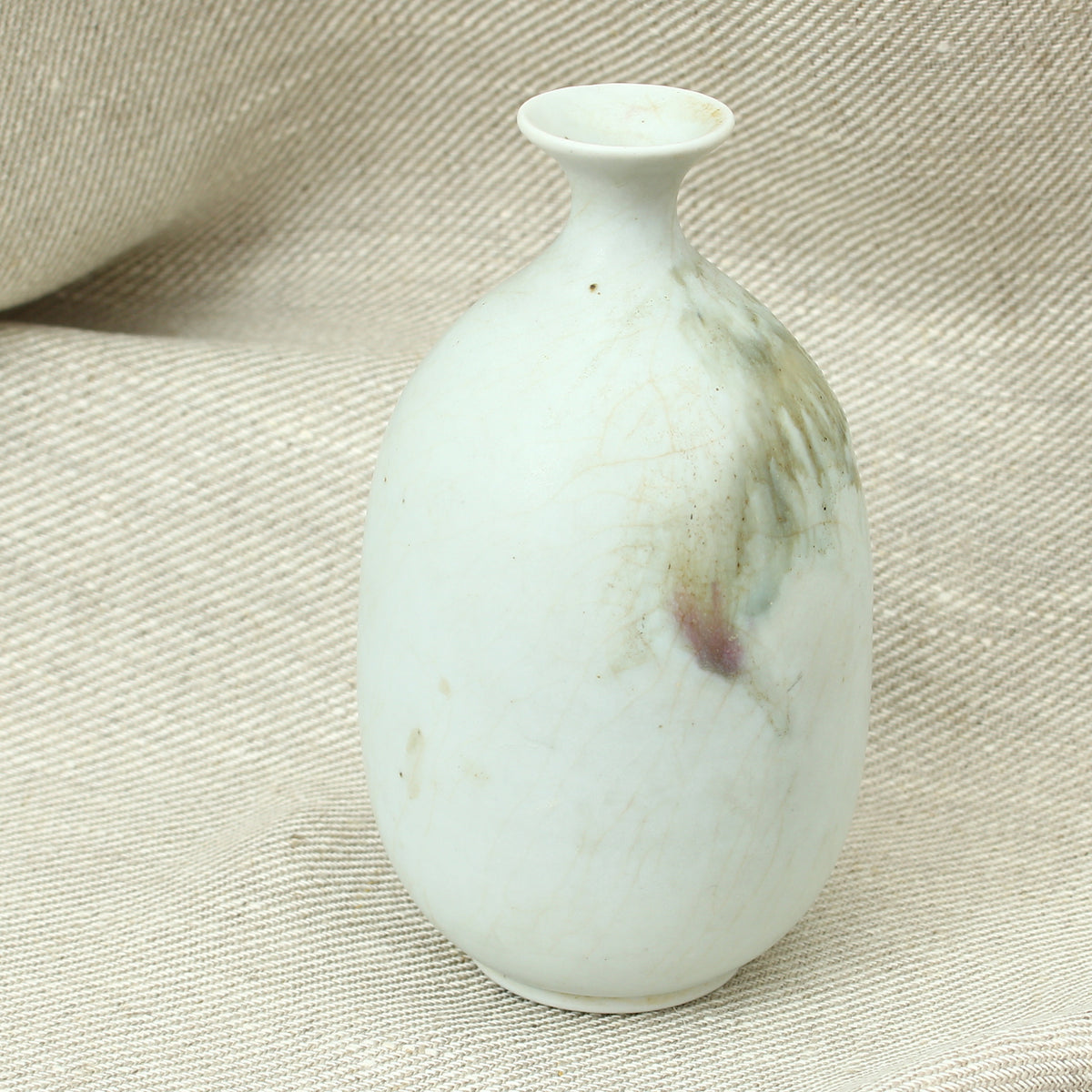 Tina Forrester (Studio Pottery) white porcelain tokkuri shape vase, decorated with green and burgundy glazed hues, 14.5cm high, painted mark to base
