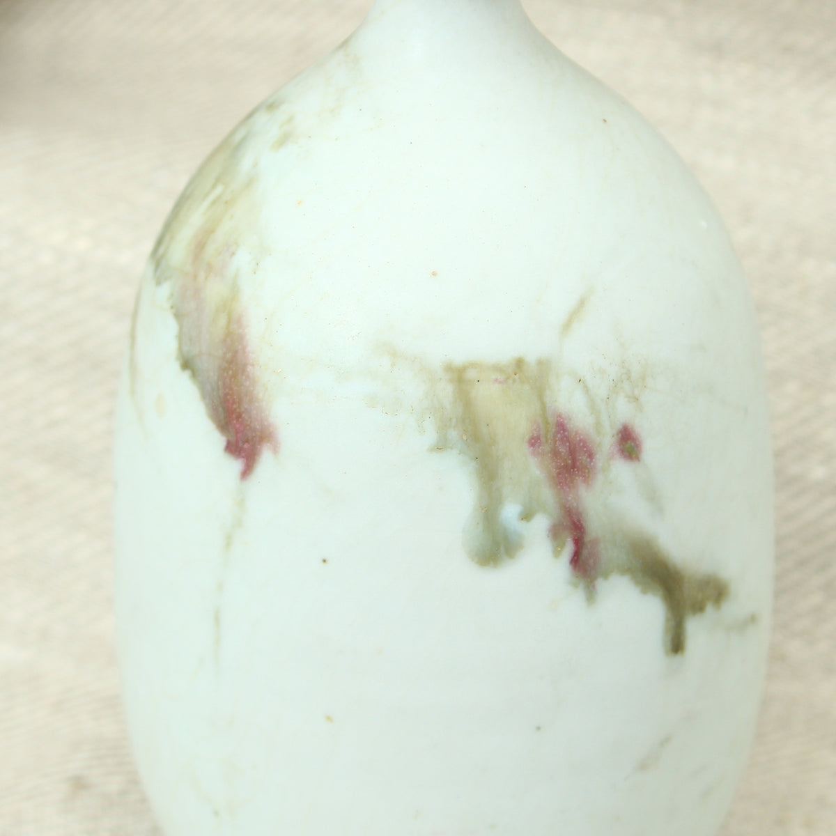 Tina Forrester (Studio Pottery) white porcelain tokkuri shape vase, decorated with green and burgundy glazed hues, 14.5cm high, painted mark to base