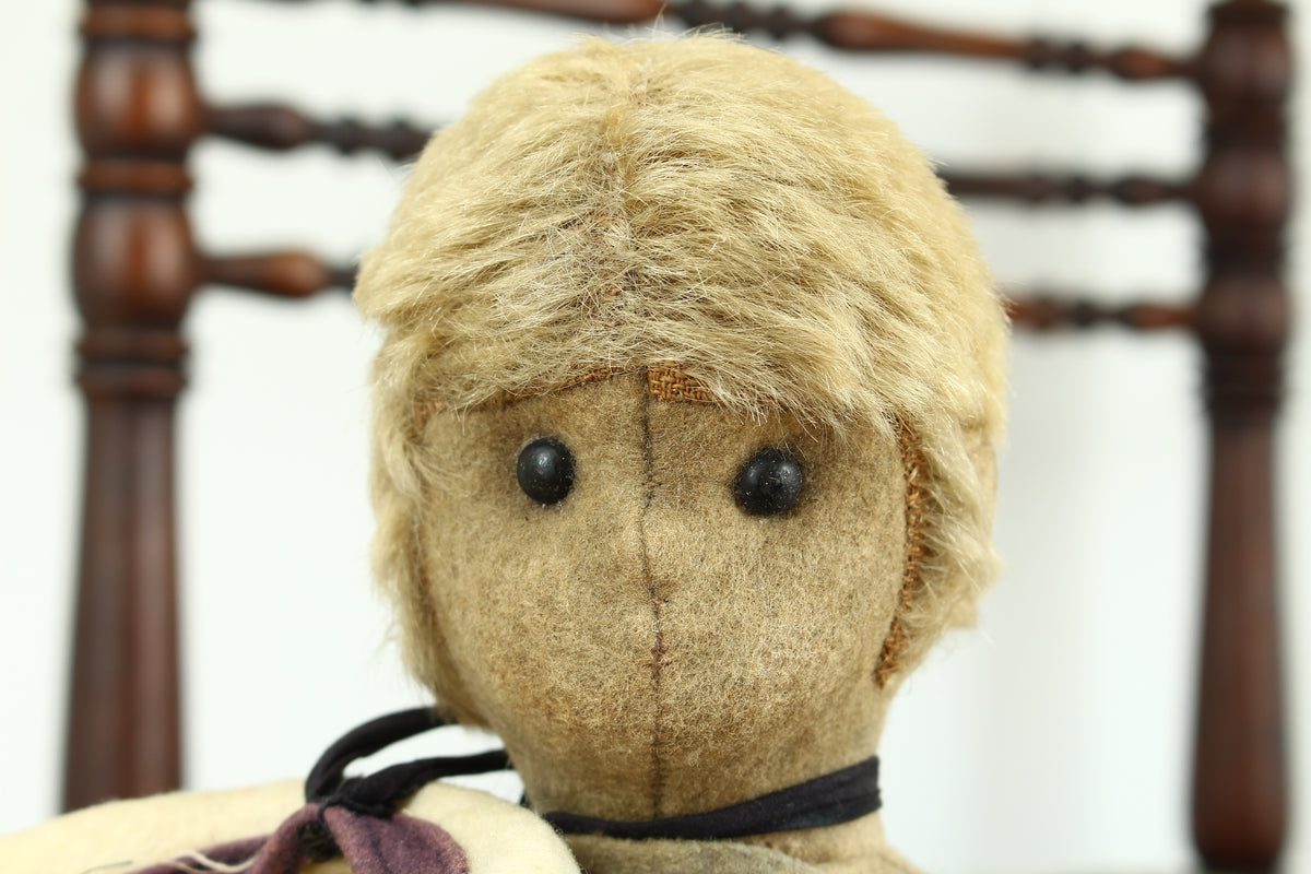 Toys & Juvenalia - an early 20th century straw-filled felt and mohair sailor doll, in the Steiff style