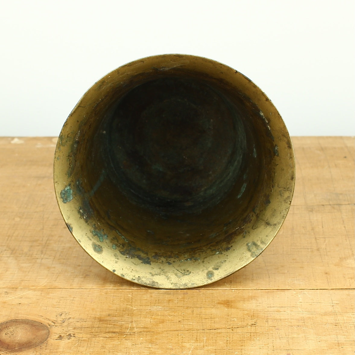 A 19th century bronze mortar and pestle, cylindrical form with girdle and everted rim
