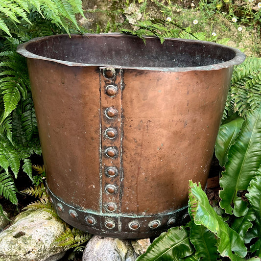 A late 19th century/early 20th century riveted copper boiler or country house fuel bin