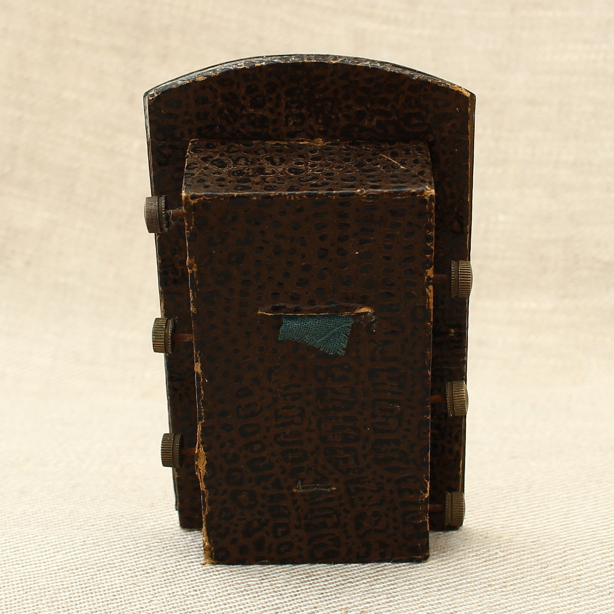 An early 20th century Japanese perpetual desk calendar, the cast metal face plate probably manufactured from antimony or a similar alloy