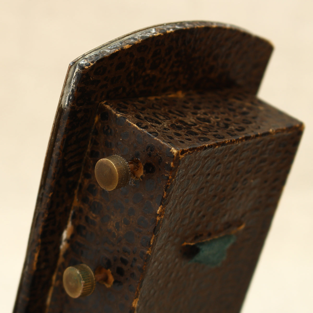 An early 20th century Japanese perpetual desk calendar, the cast metal face plate probably manufactured from antimony or a similar alloy