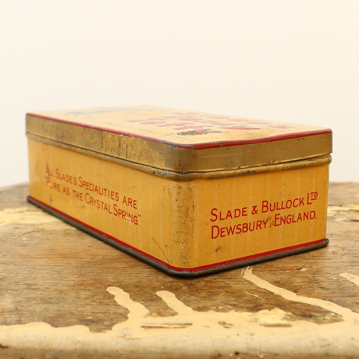 Advertising - a Slade & Bullock Ltd rounded rectangular shaped pictorial advertising tin