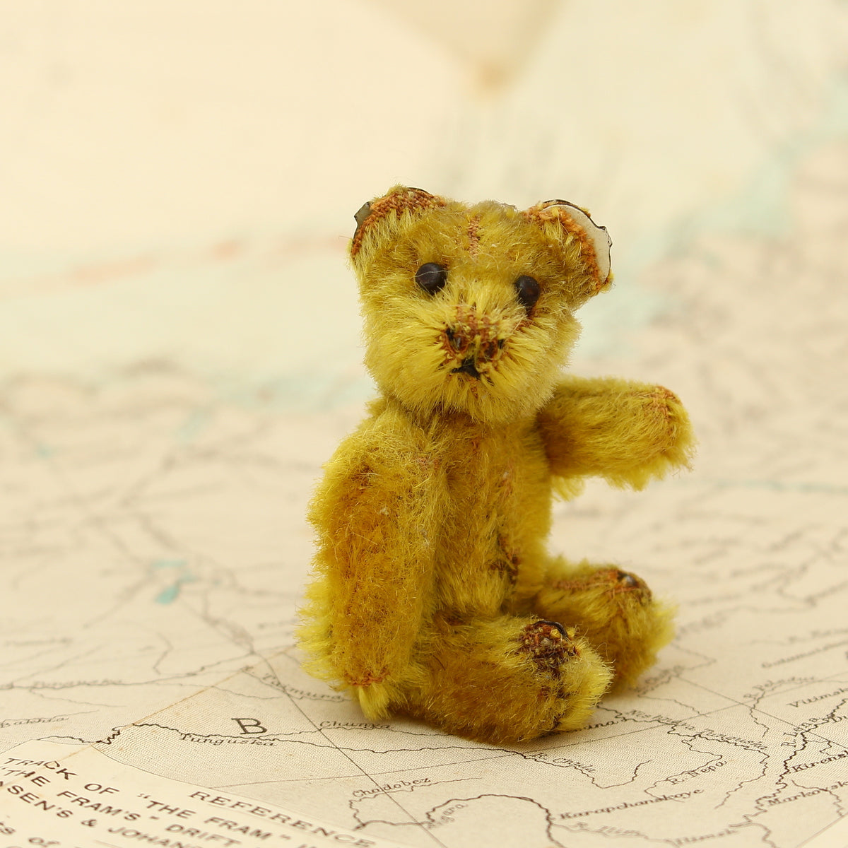 Toys & Juvenalia - a Schuco (Germany) miniature golden mohair jointed teddy bear, c.1930