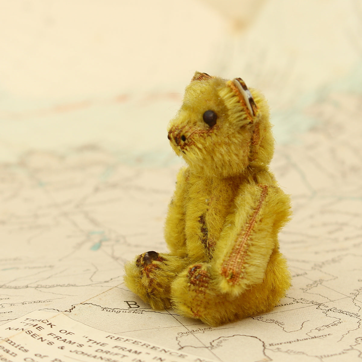 Toys & Juvenalia - a Schuco (Germany) miniature golden mohair jointed teddy bear, c.1930